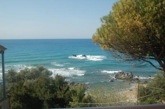 'Pelekas beach - view from our room's balcony at Sun Rock hostel' - Κέρκυρα
